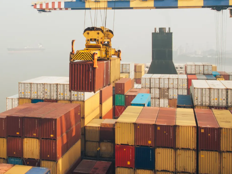 Export-ready steel products staged at container yard for overseas delivery